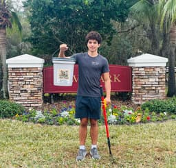 Benjamin at the FishHawk community sign