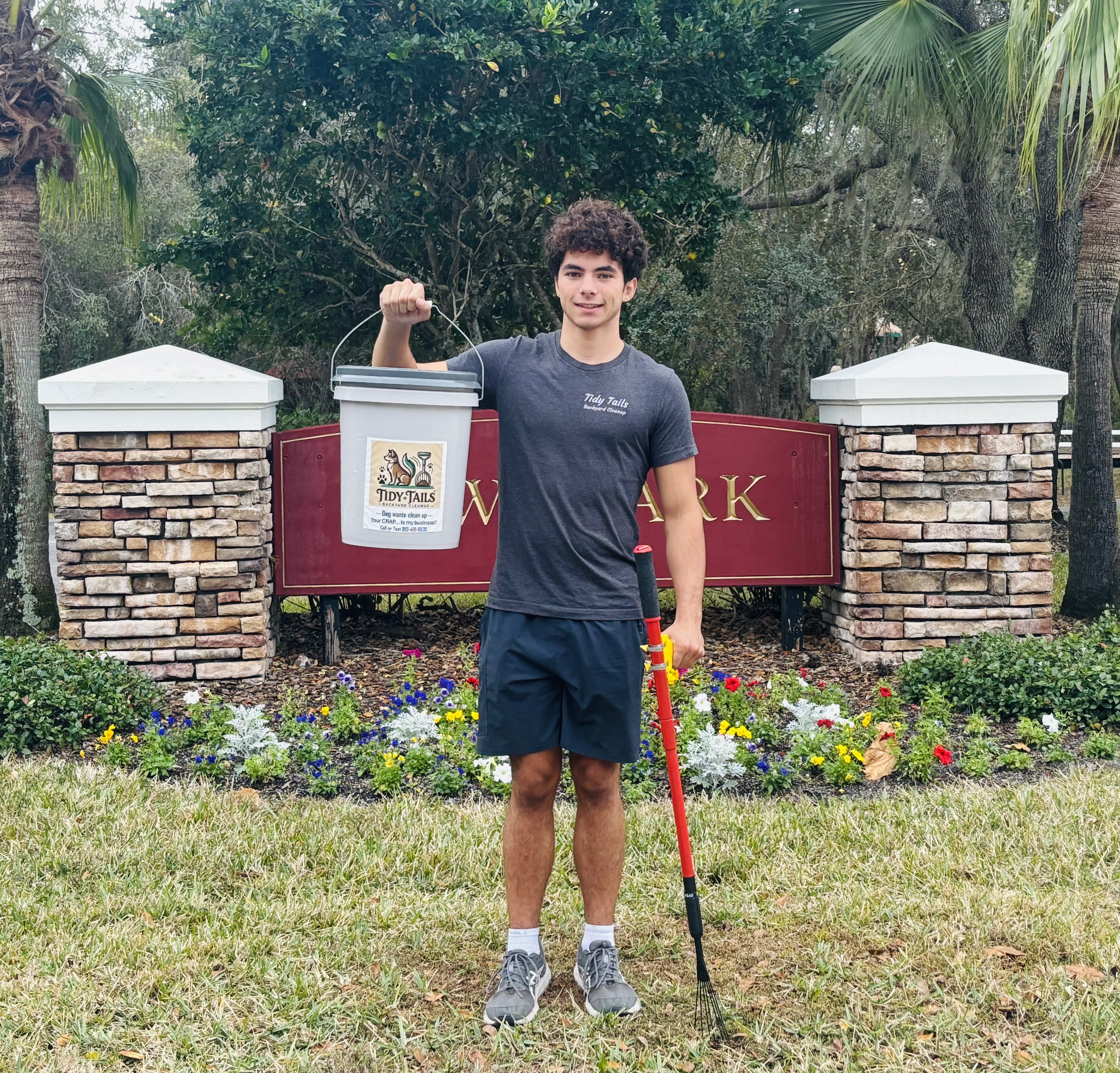 Ben, owner of Tidy Tails Backyard Cleanup, with his equipment
